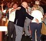A conga line dancing at UNICA 2002.