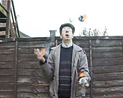 Arthur played by Gordon Bullock juggling hot rocks.