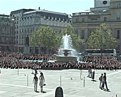 Part of the crowd, played by peas, inserted into image of Trafalgar Square.