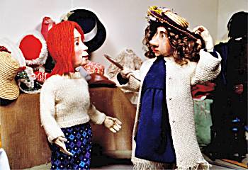 Ladies trying on hats in 'The Grand Sale'.