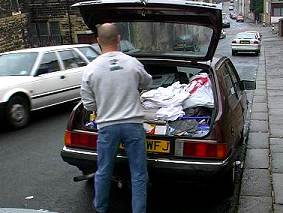 Kevin packing his car to move to London.