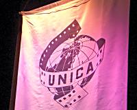 Photo of the UNICA banner hanging in the cinema.