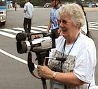 Val Ellis with camcorder.