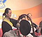 Traditional percussion player with gong.